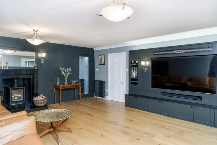Cinema room with a bespoke built-in media wall and art-deco style
