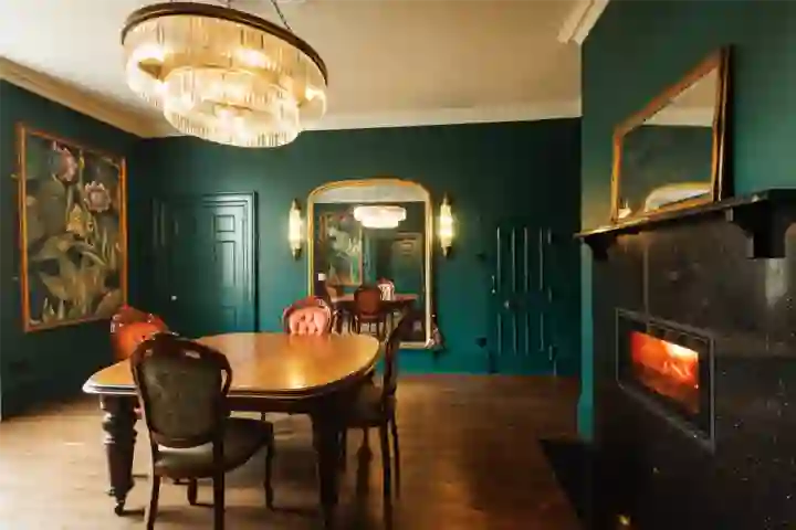 in Georgian house, green panelling and decorative artwork with in built fireplace
