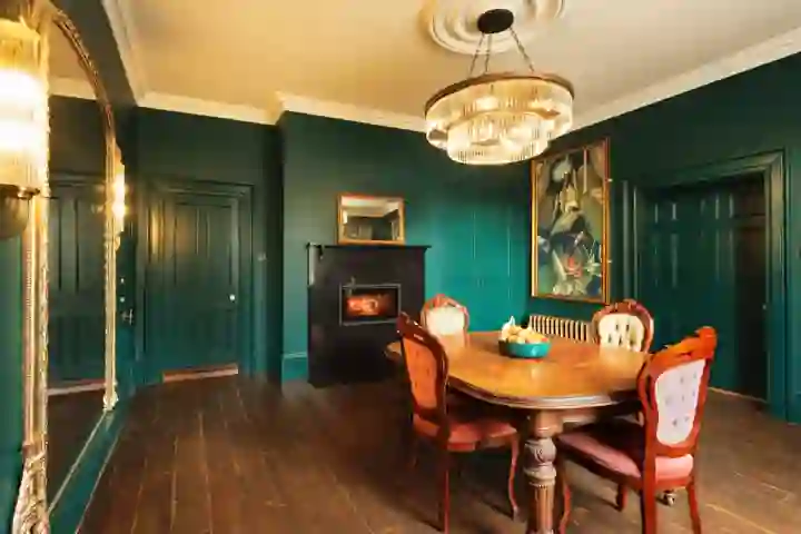 in Georgian house, green panelling and decorative artwork 