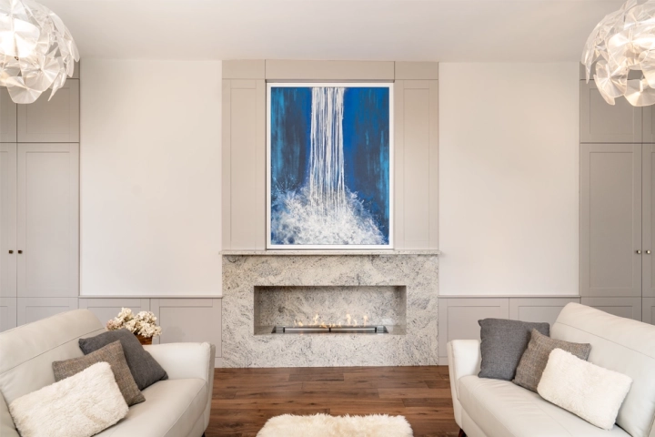 Drawing room with an oil painting above a bespoke built-in bioethanol fire