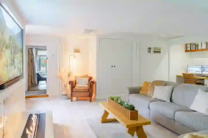 Home office with white cork flooring and bioethanol fire