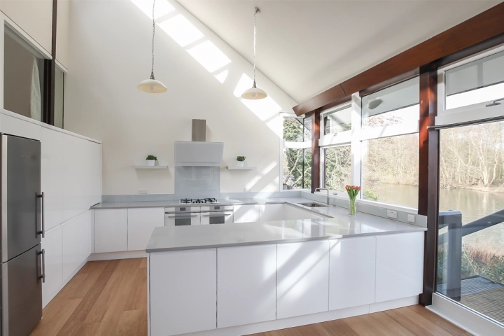 Contemporary minimalist kitchen with handless cabinets