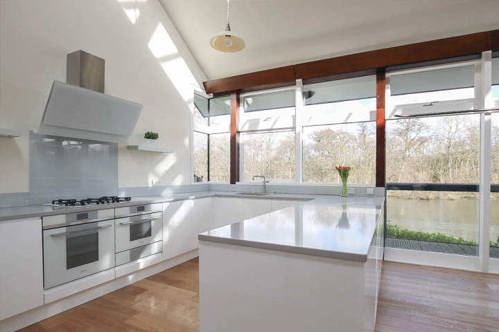 Contemporary kitchen with quartz worktops and large windows