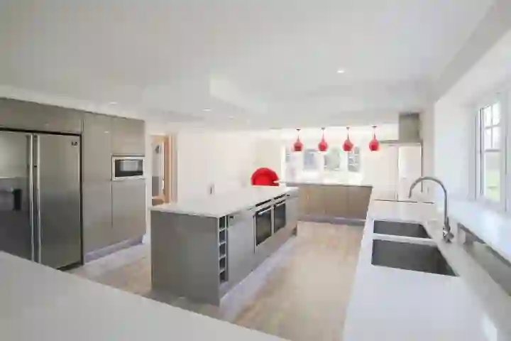 Open plan modern kitchen with chrome 