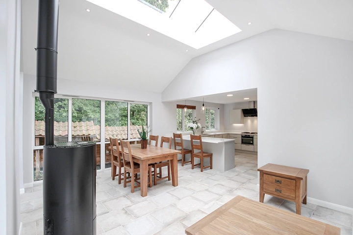 Modern kitchen with in built appliances seperate dining area