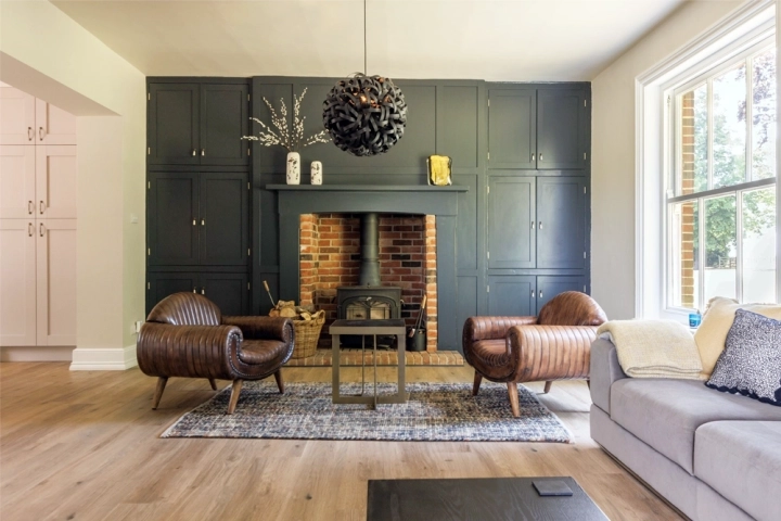 Cinema room with dark wall panelling and oak flooring