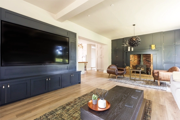 Cinema room with a bespoke built-in media wall and art-deco style