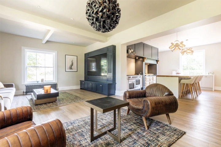 Cinema room with oak flooring and wood burner