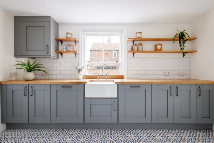 Coastal kitchen design traditional with gre/blue cabinets and Belfast sink