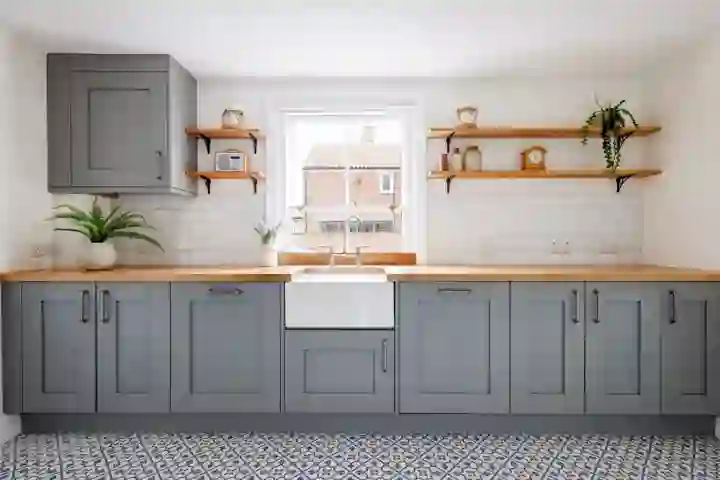 Coastal kitchen design traditional with gre/blue cabinets and Belfast sink