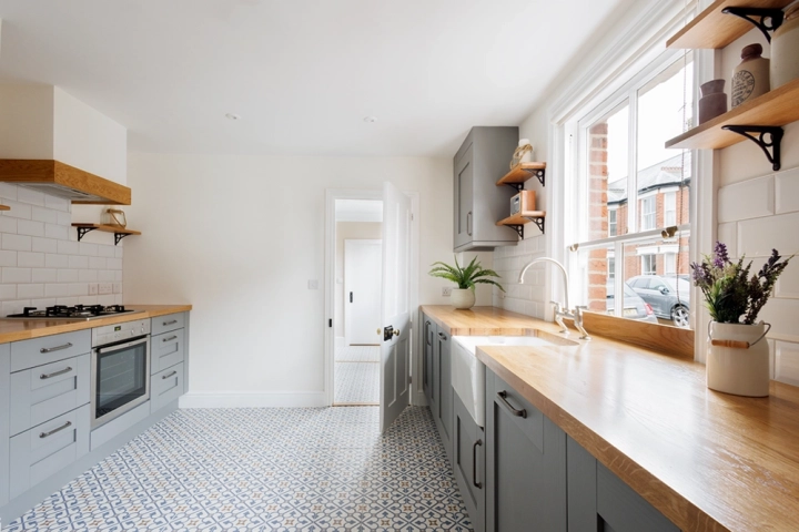 Shaker style kitchen with oak worktops and belfast sink