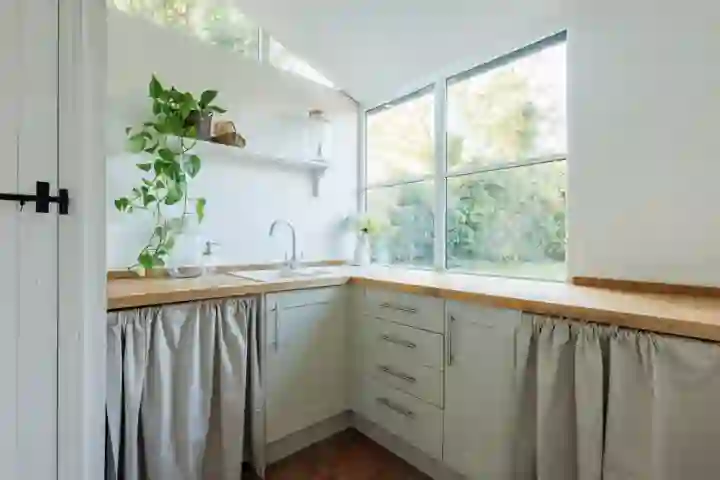 Utility with curtains covering appliances