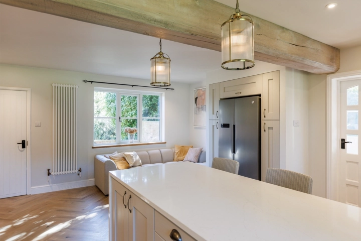 Farmhouse kitchen with brass pendant lights