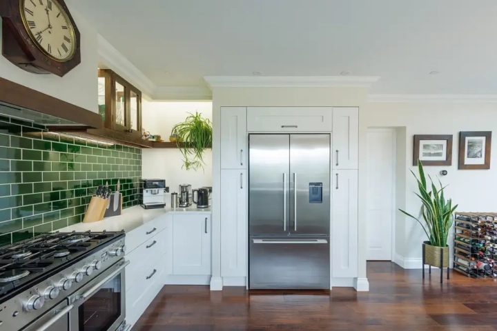 free standing amercian style fridge freezer in bespoke built in kitchen units